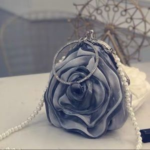 three-dimensional flowers with rhinestone clutch